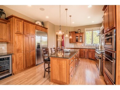 Kitchen features gourmet stainless steel appliance