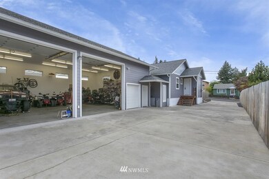 HUGE detached garage/shop. Enough room to fit 6 cars and all your toys.