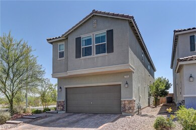 Traditional home featuring stone siding, stucco si