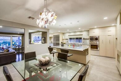 Dining area looks over the kitchen and family room