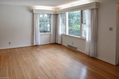 Living room with hardwood flooring and a picture w