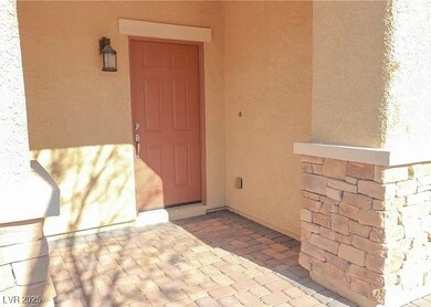 Property entrance featuring stucco siding