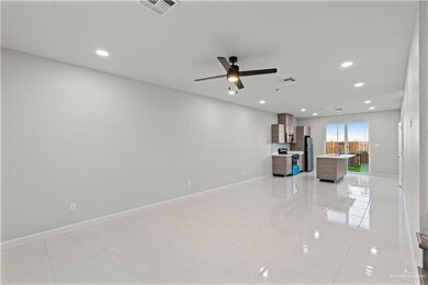 Unfurnished living room featuring ceiling fan, light tile patterned floors, visible vents, recessed lighting, and baseboards