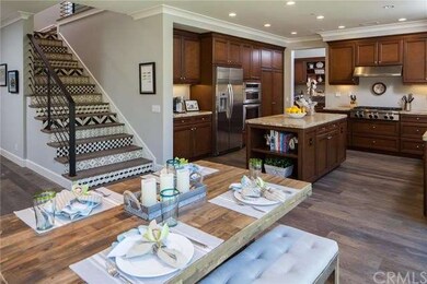 Dining area flows seamlessly into chef's kitchen.