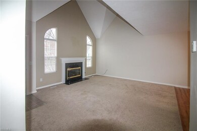 Living Room with fireplace and vaulted ceilings