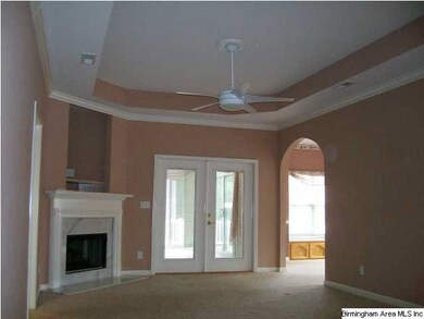 Large Family Room with arched doorways, tray ceili