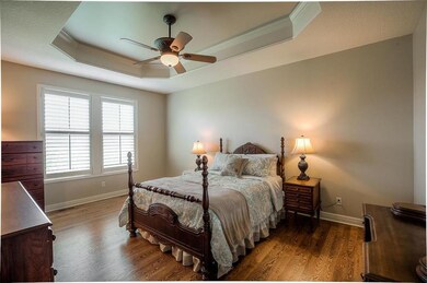 Main floor master bedroom boasts hardwood floors, 