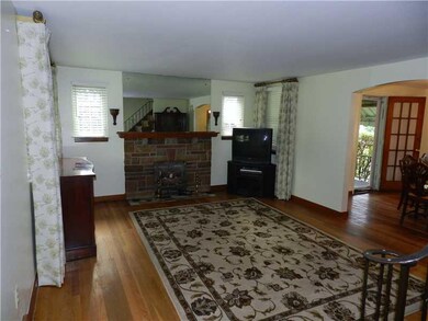 Living Room. Gleaming hardwoods featured in this l