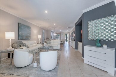 Living area with ornamental molding, recessed ligh