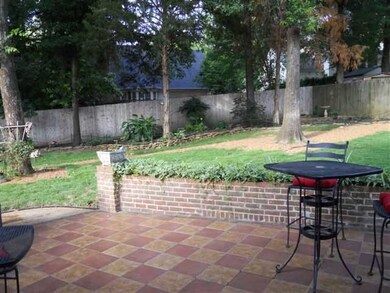Beautifully landscaped fenced backyard features st