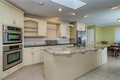 Updated kitchen area with double ovens, gas stove,