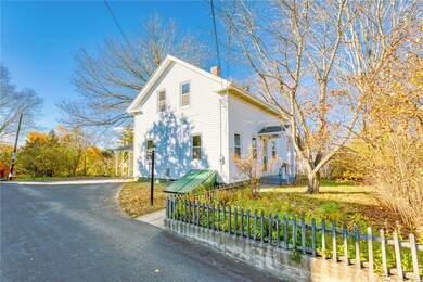 Side view from driveway with views of private fenc