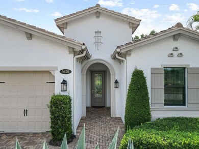 Doorway to property featuring a garage