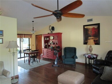 Living room looking into dining room; glass doors 