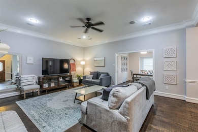 Living room features hand-scraped hard wood floors