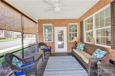 Screened-in porch with sun shades