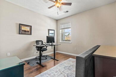 Office space featuring baseboards, ceiling fan, da