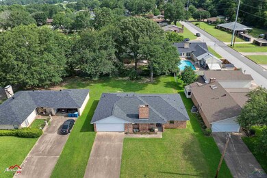 View of subject property with a pool area