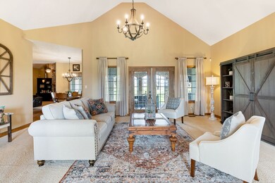 Large 16x22 Great Room with vaulted ceilings opens up to the covered back porch