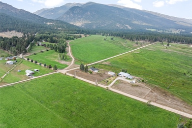 View of property location with a mountainous background and rural landscape
