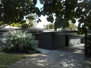 View of home's exterior with a carport