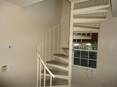 spiral stairs to upper level