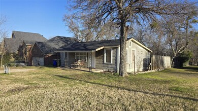 View of front of home featuring a front yard and c