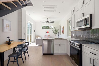 Kitchen featuring light wood-style floors, a peni