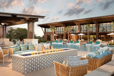 Community pool with an outdoor hangout area and a