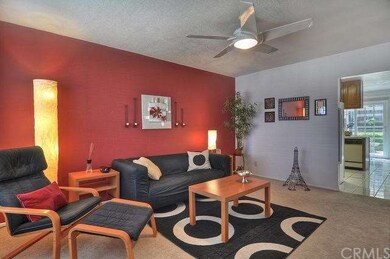Picture perfect living room with ceiling fan.