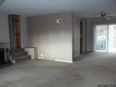 Features include fireplace and arched doorways.