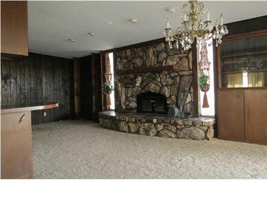 Family room with petrified wood fireplace