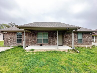 Back of property with a patio and a yard