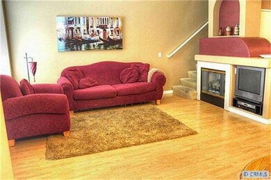 There is a gas fireplace and an alcove media cente