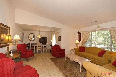 Living room with dining area at far end (adjacent 