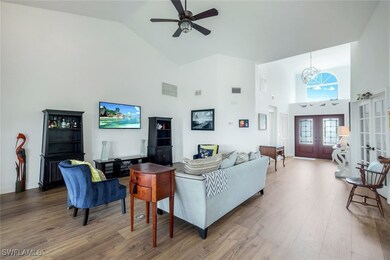 Living room with high vaulted ceiling, wood finish