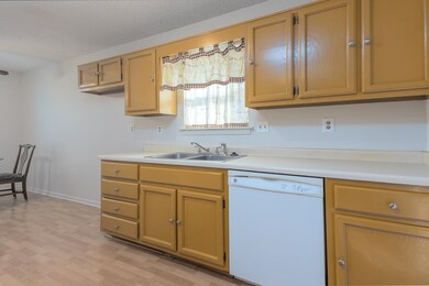 Kitchen featuring light countertops, light wood-st