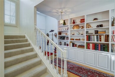 Staircase with light hardwood floors