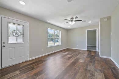 Entryway featuring wood-type flooring and ceiling 
