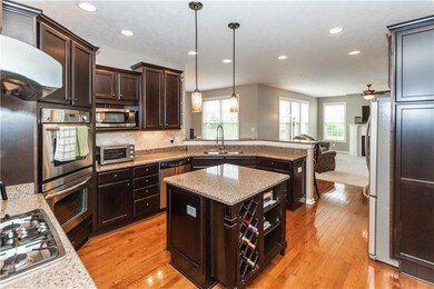 Quartz Counter tops, middle island, double oven, gas range top