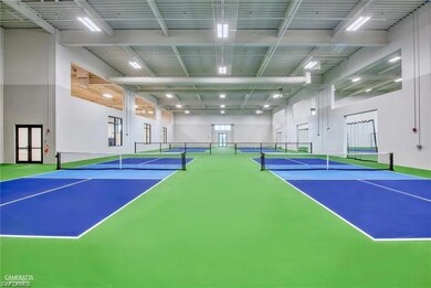 View of sport court featuring fence