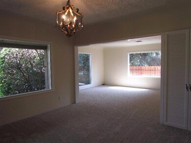 Lovely formal dining with beautiful picture windows...