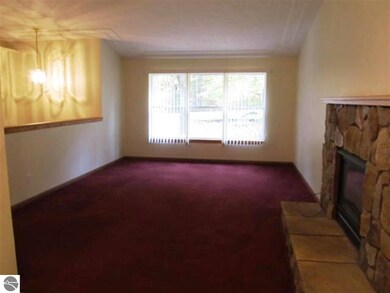This living room features a gas fireplace as well 