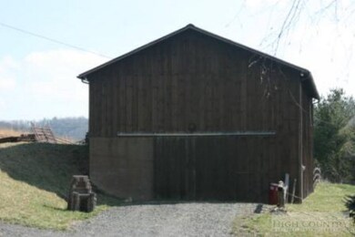 Barn & Studio: 8 stalls, tack room and hay loft. S