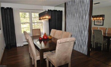 Living room opens to the dining room w/decorative 