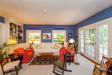 Living room features generous pocket...