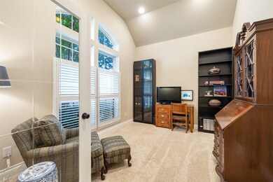 The spacious study also boasts a wall of stacked windows with plantation shutters, to overlook the front yard and fill the space with natural light.