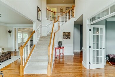 2-story entry foyer with chair rail, picture moldi