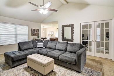 This photo shows the large living room, the flexible 4th bedroom or study, and kitchen / dining areas.