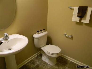 convenient and roomy half-bath off garage entry